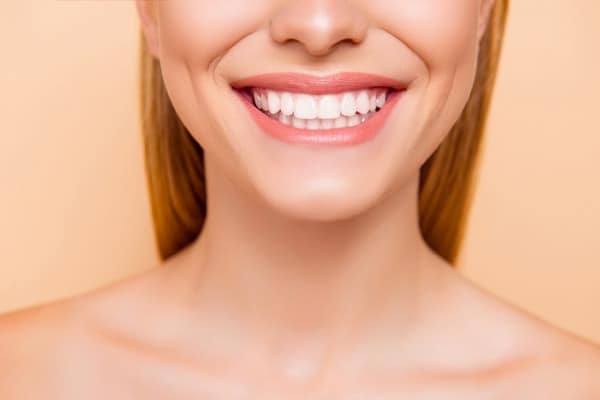 Close-up of a woman smiling with perfect white teeth